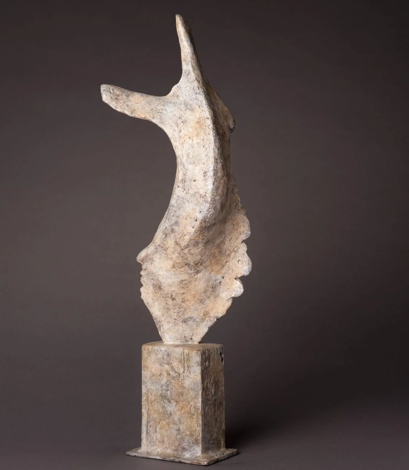 Abstract bronze sculpture of a human torso