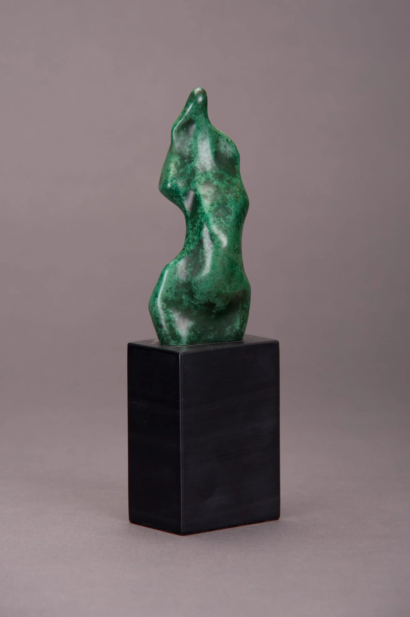 Abstract bronze sculpture of a human torso